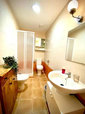 a bathroom with a sink and a toilet and a sink at MyChoice Casa Lilia in Rota