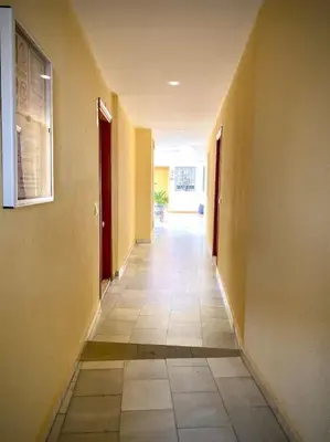 a hallway of a building with a tile floor at MyChoice Casa Lilia in Rota