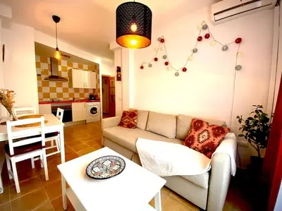 a living room with a couch and a table at MyChoice Casa Lilia in Rota