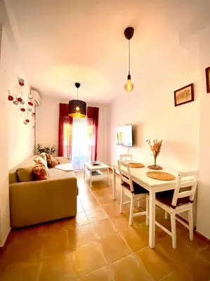 a living room with a couch and a table at MyChoice Casa Lilia in Rota