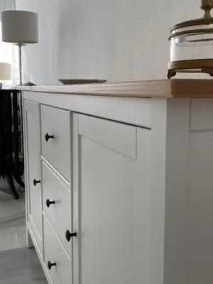 a white kitchen with a wooden counter top at Jerez Avenida in Jerez de la Frontera