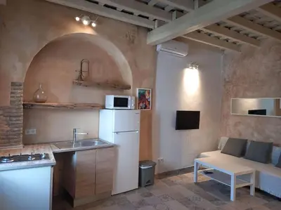 a kitchen with a sink and a white refrigerator at Casa Florinda #5 in Jerez de la Frontera