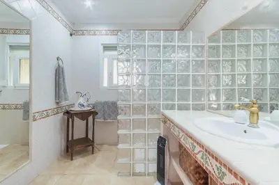 a bathroom with a sink and a shower and a tub at Cadizz - Villa Verde- La Barrosa - ideal familias y grupos de amigos in Chiclana de la Frontera
