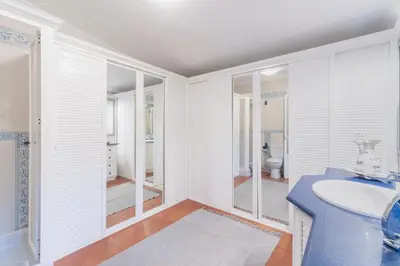 a white bathroom with a sink and a toilet at Cadizz - Villa Verde- La Barrosa - ideal familias y grupos de amigos in Chiclana de la Frontera