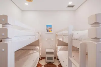 a bedroom with two bunk beds in a room at El Pez Volador by Gades Gestión in Cádiz