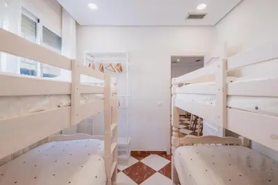 a bedroom with two bunk beds in a room at El Pez Volador by Gades Gestión in Cádiz