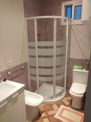 a bathroom with a shower and a toilet at Casa araceli in Chipiona