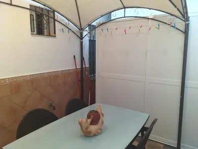 a plastic toy of a rubber duck sitting on a table at Casa araceli in Chipiona