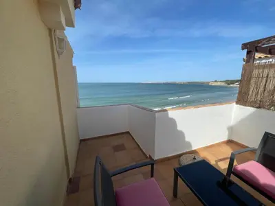 a balcony with a view of the ocean at Primera Línea Playa el Manantial in El Puerto de Santa María