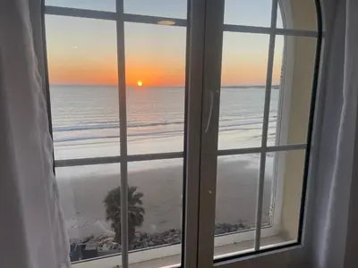 a view of the beach from a window at Primera Línea Playa el Manantial in El Puerto de Santa María