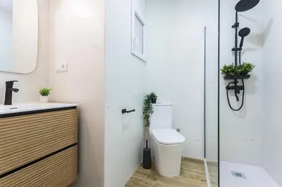 a bathroom with a toilet and a sink at Playa Santa Maria Moderno 3 Rooms in Cádiz