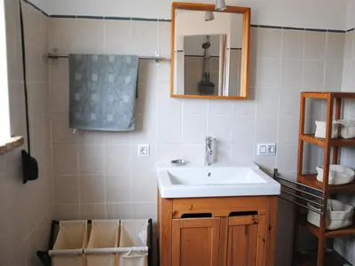 a bathroom with a sink and a mirror at Torre Andaluz Villa con piscina 2 habitaciones in Cádiz