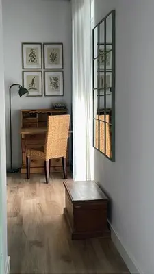 a living room with a desk and a chair at El Taller in Jerez de la Frontera