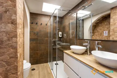 a bathroom with two sinks and a shower at Buenos Aires by LiveWork in Cádiz