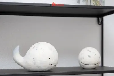 two white eggs sitting on a shelf at El Anfitrión - Casa Dunas in Sanlúcar de Barrameda
