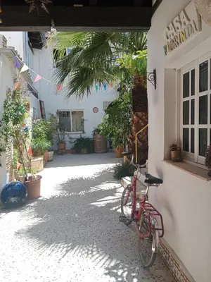 a red bike parked next to a building at Casa Florinda #4 in Jerez de la Frontera