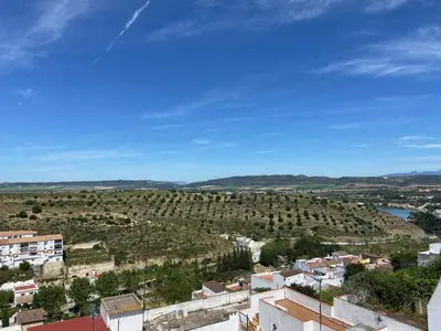 a view of a town with trees and buildings at La Pequeña Morada in Arcos de la Frontera