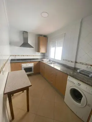 a kitchen with a washing machine and a sink at Asís 20.7 in Medina Sidonia