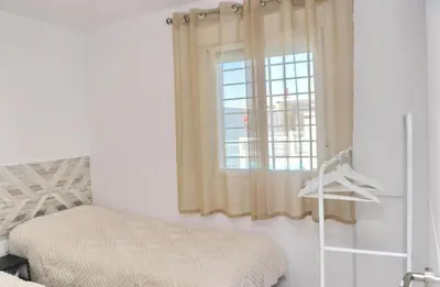 a bedroom with a bed and a window at Apartamento Rural Marisma in Hozanejos