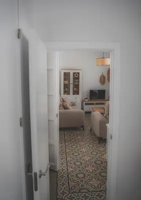 an open door to a living room with a couch at Casa Herrete 15 in Medina Sidonia