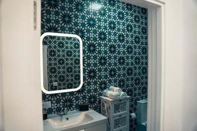 a bathroom with a sink and a mirror at Casa Herrete 15 in Medina Sidonia
