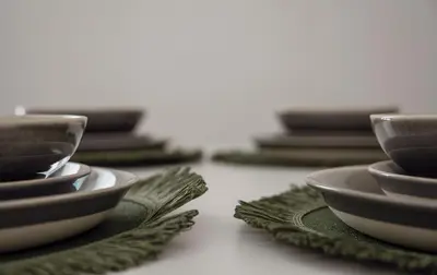a row of bowls and plates on a table at Casa Herrete 15 in Medina Sidonia