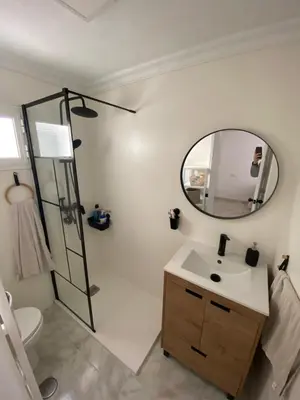 a bathroom with a sink and a mirror at Casa El Rincón de San Pedro in Arcos de la Frontera