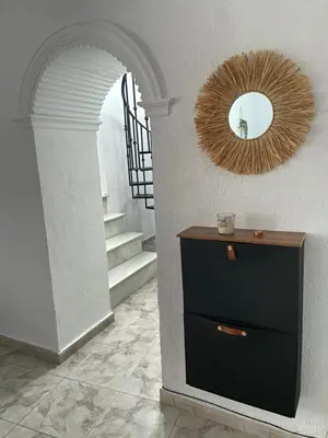 a small kitchen with a stove and a window at Casa El Rincón de San Pedro in Arcos de la Frontera