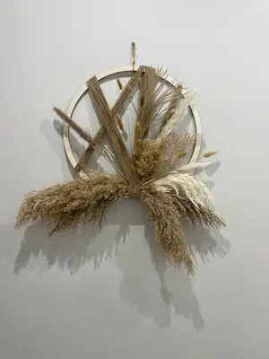 a bunch of ears of wheat hanging on a wall at Apartamento corredera 1 in Arcos de la Frontera