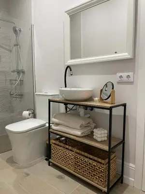 a bathroom with a sink and a toilet and a mirror at Apartamento corredera 1 in Arcos de la Frontera