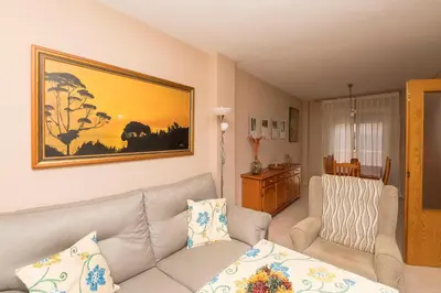 a living room with a couch and a table at Rosamar in Chiclana de la Frontera