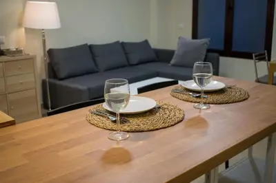 two wine glasses sitting on top of a table at Allo Apartments Caballeros II Centro 1 Habitación in Jerez de la Frontera