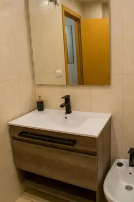 a bathroom with a sink and a mirror at Allo Apartments Caballeros II Centro 1 Habitación in Jerez de la Frontera
