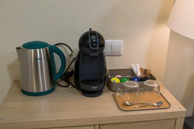 a black blender sitting on top of a counter with glasses at Allo Apartments Caballeros II Centro 1 Habitación in Jerez de la Frontera