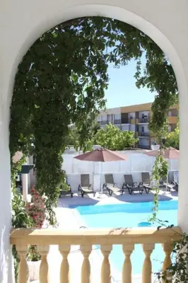 a view of a swimming pool from a balcony at Hotel Al Sur De Chipiona by YouRoom in Chipiona