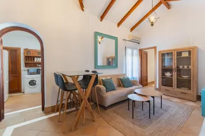 a living room with a couch and a table at Encantador piso Plaza Rivero in Jerez de la Frontera