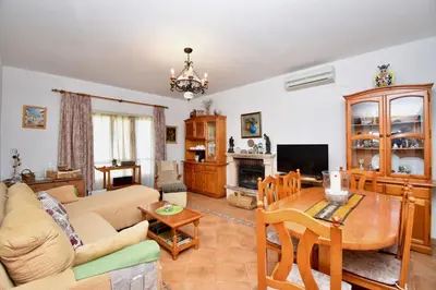 a living room with a couch and a table at Recreo de Pilant - Holiday Chiclana in Chiclana de la Frontera