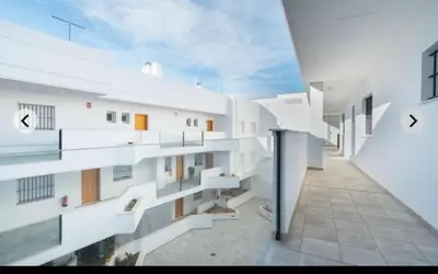 a view of a building with white walls at ATICO CALLE FARIÑAS in Sanlúcar de Barrameda