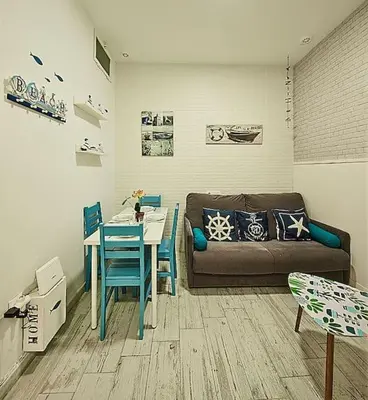 a living room with a couch and a table at The Sailors House Ha in Cádiz