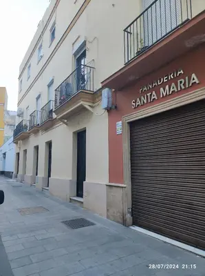 a building with a garage door on a street at Puerto Placilla in El Puerto de Santa María