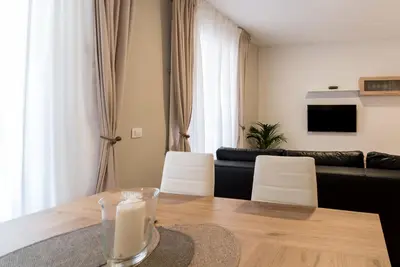 a living room with a table and a couch at Fabio Catedral II in Cádiz