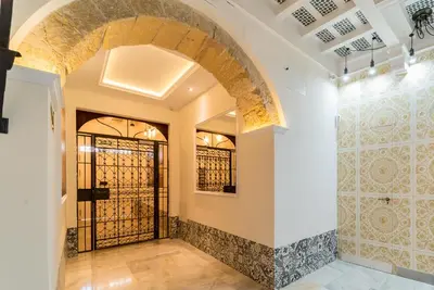 a tasting room with a door to a wine cellar at Fabio Catedral II in Cádiz