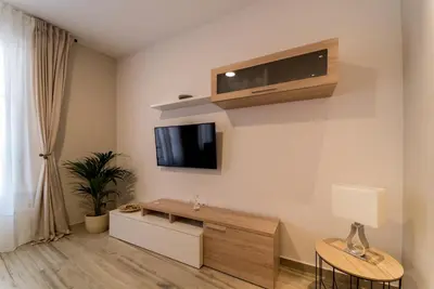 a living room with a flat screen tv on the wall at Fabio Catedral II in Cádiz