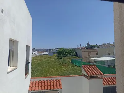 a view from a window of a white building at Argentina in Chiclana de la Frontera