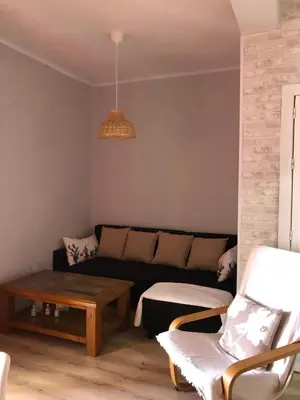 a living room with a couch and a coffee table at El sueño de Lola in Chipiona