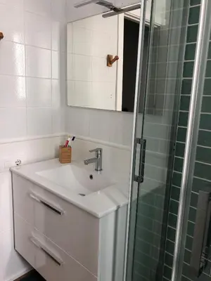a bathroom with a sink and a shower at El sueño de Lola in Chipiona