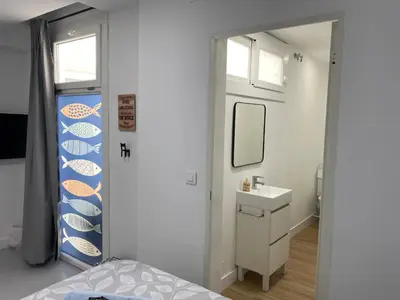 a bathroom with a sink and a mirror at Sotavento Alpisteras in Sanlúcar de Barrameda