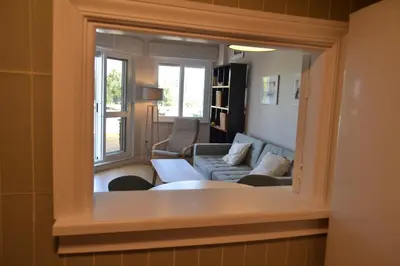 a view of a living room through a window at Apartamento Pie de Rey in Jerez de la Frontera