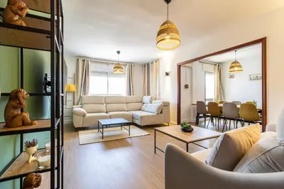 a living room with a couch and a table at CR Apartment Jerez in Jerez de la Frontera
