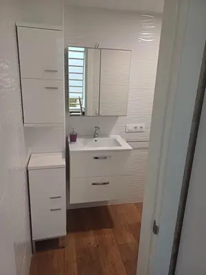 a white bathroom with a sink and a mirror at Loft Ribera Centro Izquierdo in El Puerto de Santa María
